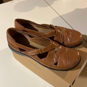 Womens tan slip on shoes by Clarks